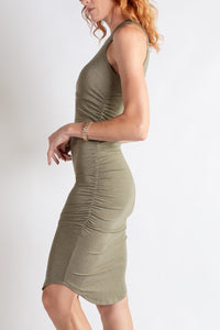 Woman wearing a green dress on a white background