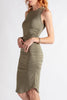 Woman wearing a green dress on a white background