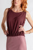 Woman wearing a two-tone dress with a white background
