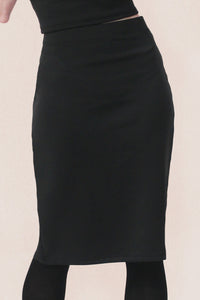 Black knee length pencil skirt on a white background