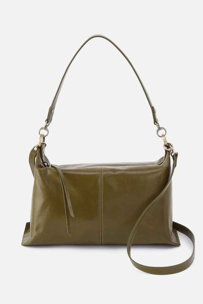 Green leather handbag on a light gray background with text indicating 'Spring 2026