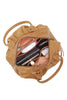 Brown leather backpack with items inside on a white background