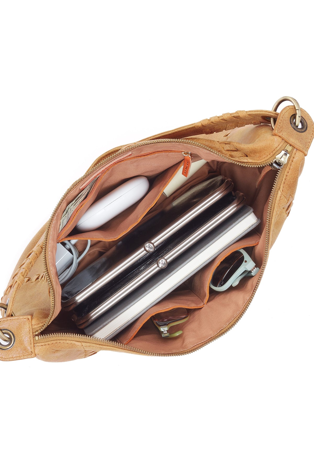 Tan leather pouch with zipper, containing pens and a bottle on a white background