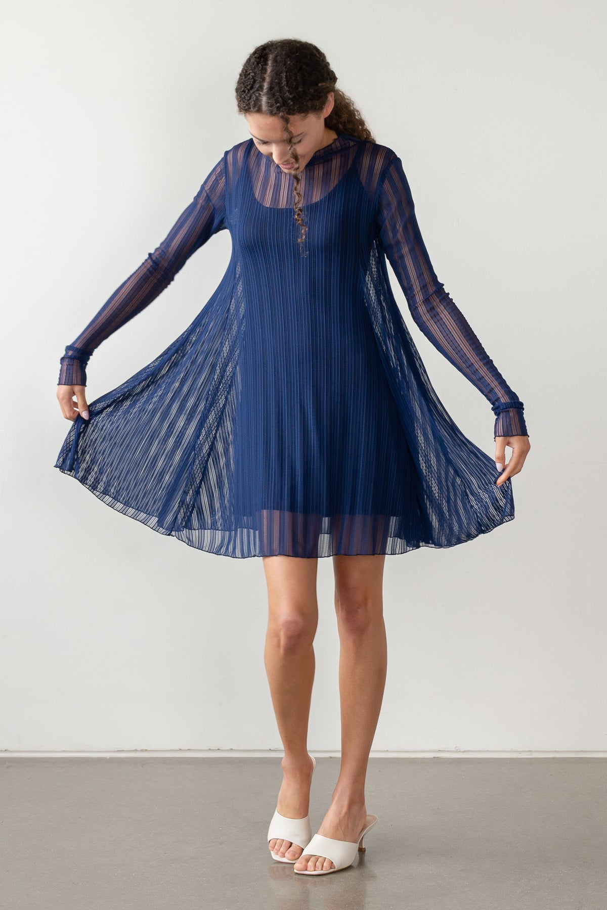 Long sleeve dress in blue, showing mesh overlay