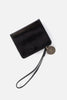 Black wristlet with a coin on a white background