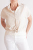 Beige short-sleeve blouse with a knot detail worn by a person on a white background