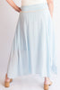 Light blue skirt worn by a person on a plain background