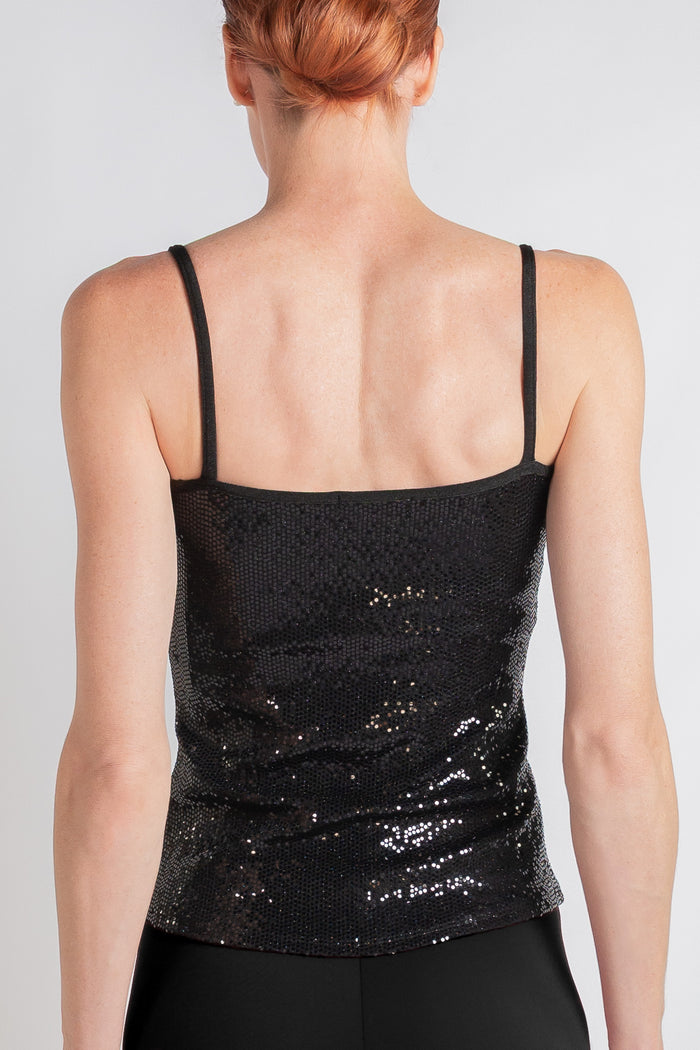 Woman wearing a black sequin cami, back view