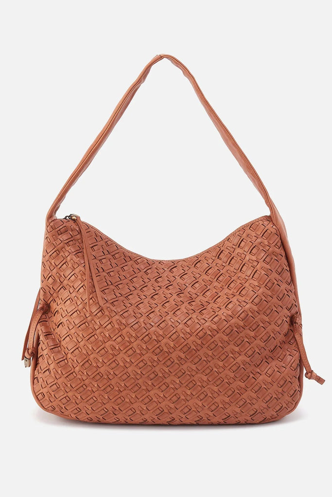 Brown textured handbag on a light gray background with text indicating 'Spring 