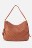 Brown textured handbag on a light gray background with text indicating 'Spring 