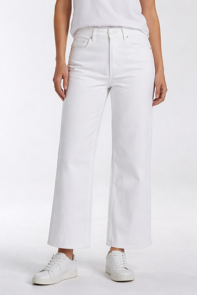 Person wearing a white t-shirt and white pants on a plain background