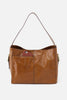 Brown leather handbag on a light gray background