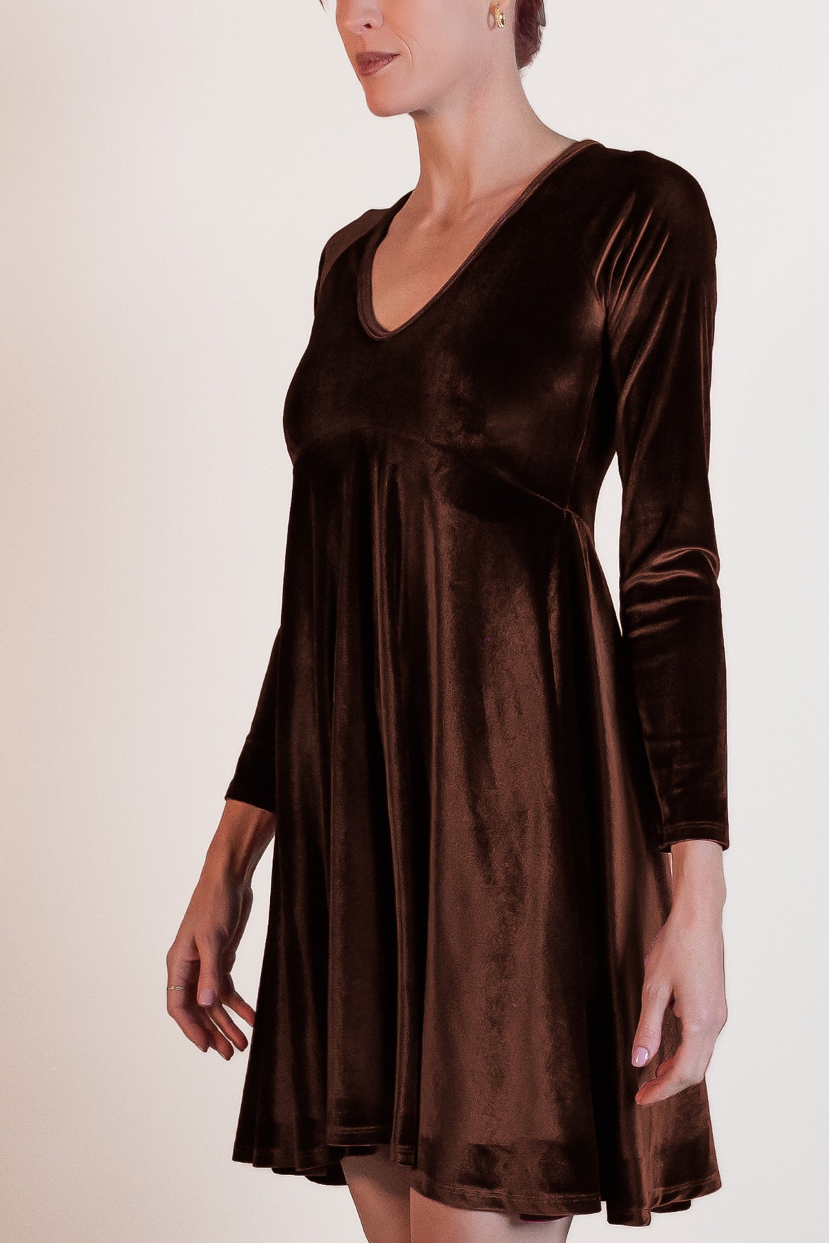 Woman wearing a brown velvet dress