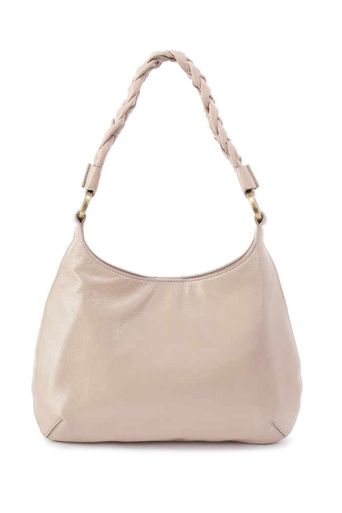 Beige handbag with braided handle on a white background