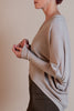 Side view of Revir Cocoon Sweater in taupe highlighting dolman shape and easy fit